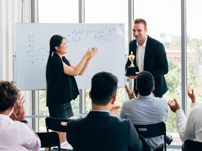 boss-awarding-workers-during-conference.jpg