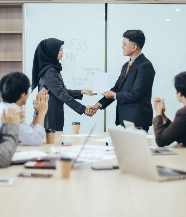 manager-awarding-workers-during-meeting.jpg